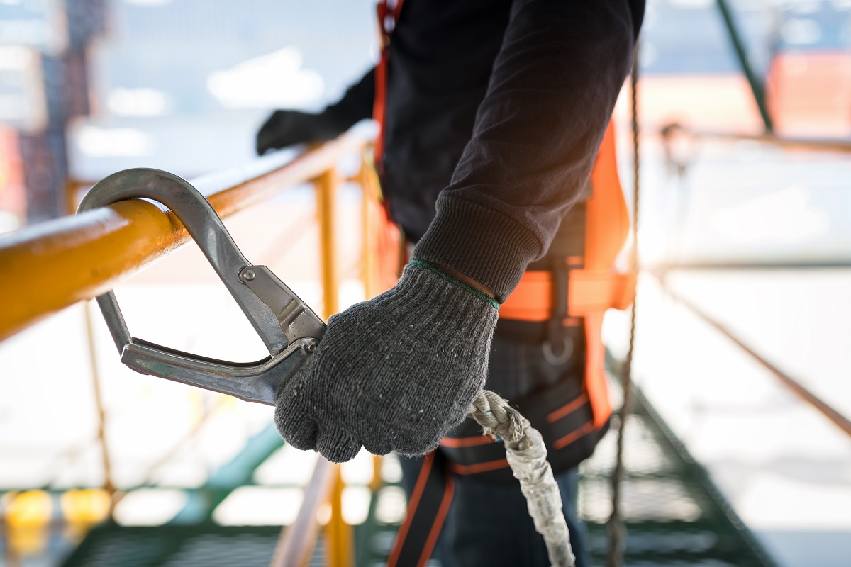 Construction worker wearing a safety harness